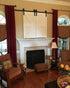 White TV Barn Doors over fireplace