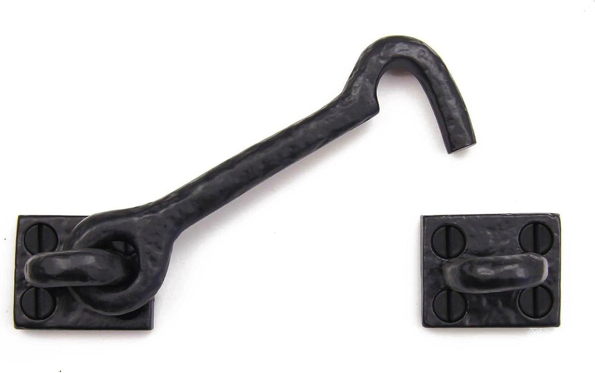 Black metal hook used as barn door lock