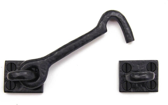 Black metal hook used as barn door lock