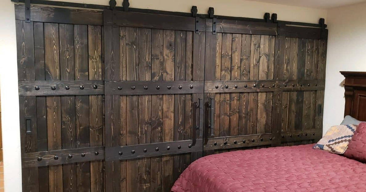 Bedroom interior featuring a bed and the Custom Double Horizon Barn Door