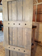 Wooden barn shutter with four metal studs detail