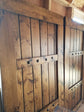 Pair of sliding wooden shutters with decorative cut-outs