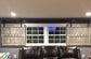 Living room with interior barn shutters on the window