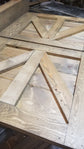 Detailed view of the wooden frame and top of the TV Barn Door Package driftwood stain