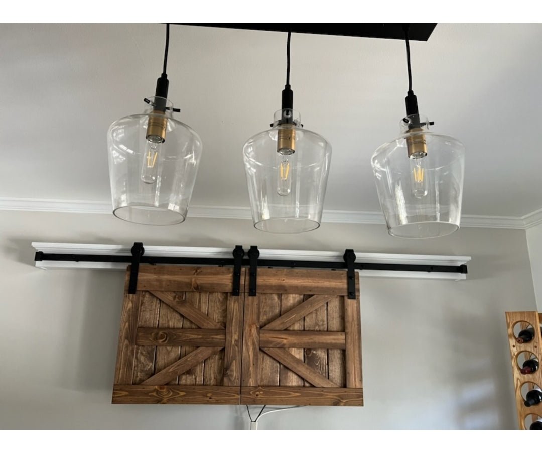 Detail of the TV Barn Door Package showcasing glass jar lamps
