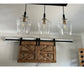 Detail of the TV Barn Door Package showcasing glass jar lamps